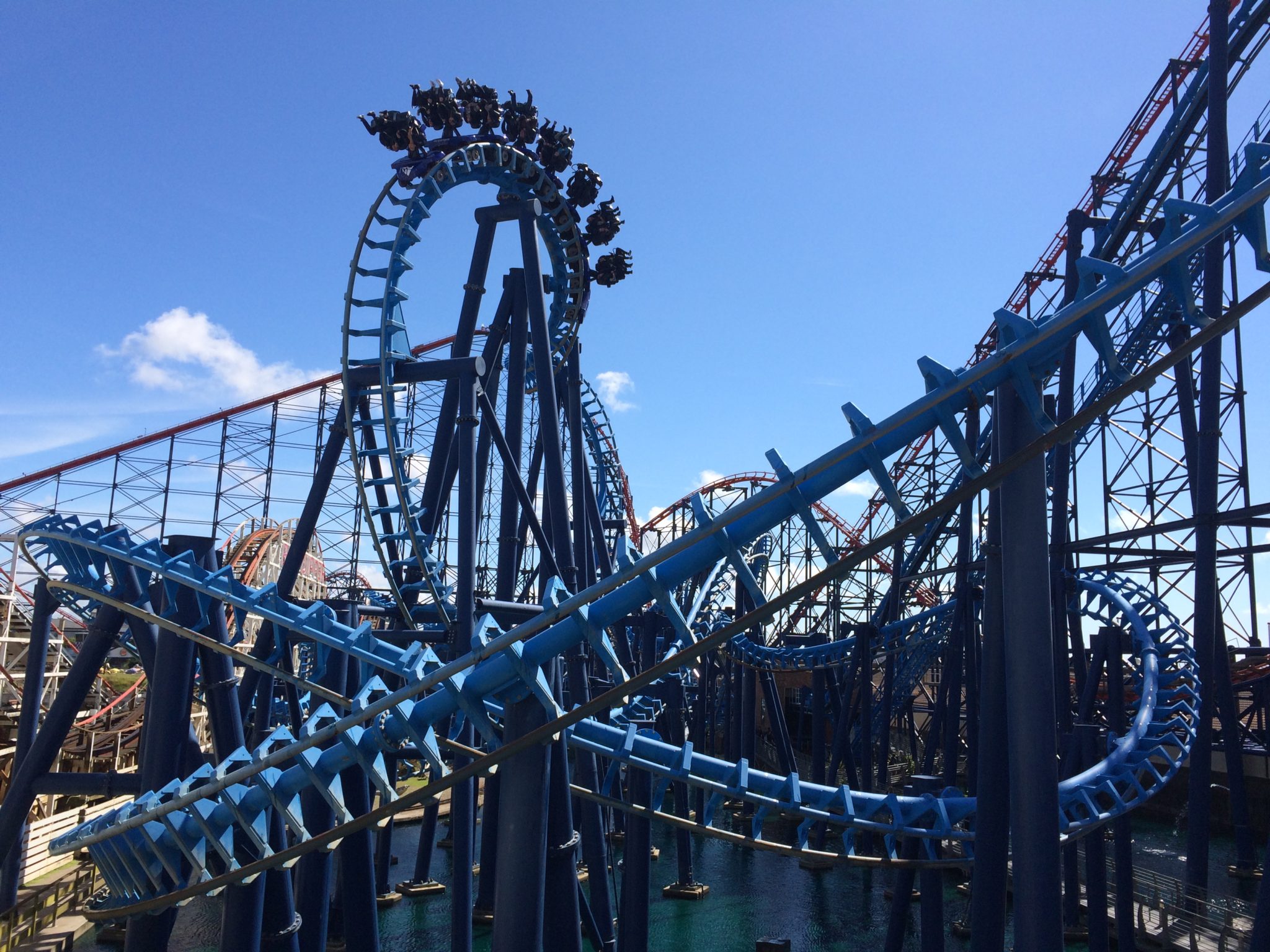 A blue inverted rollercoaster with many inversions