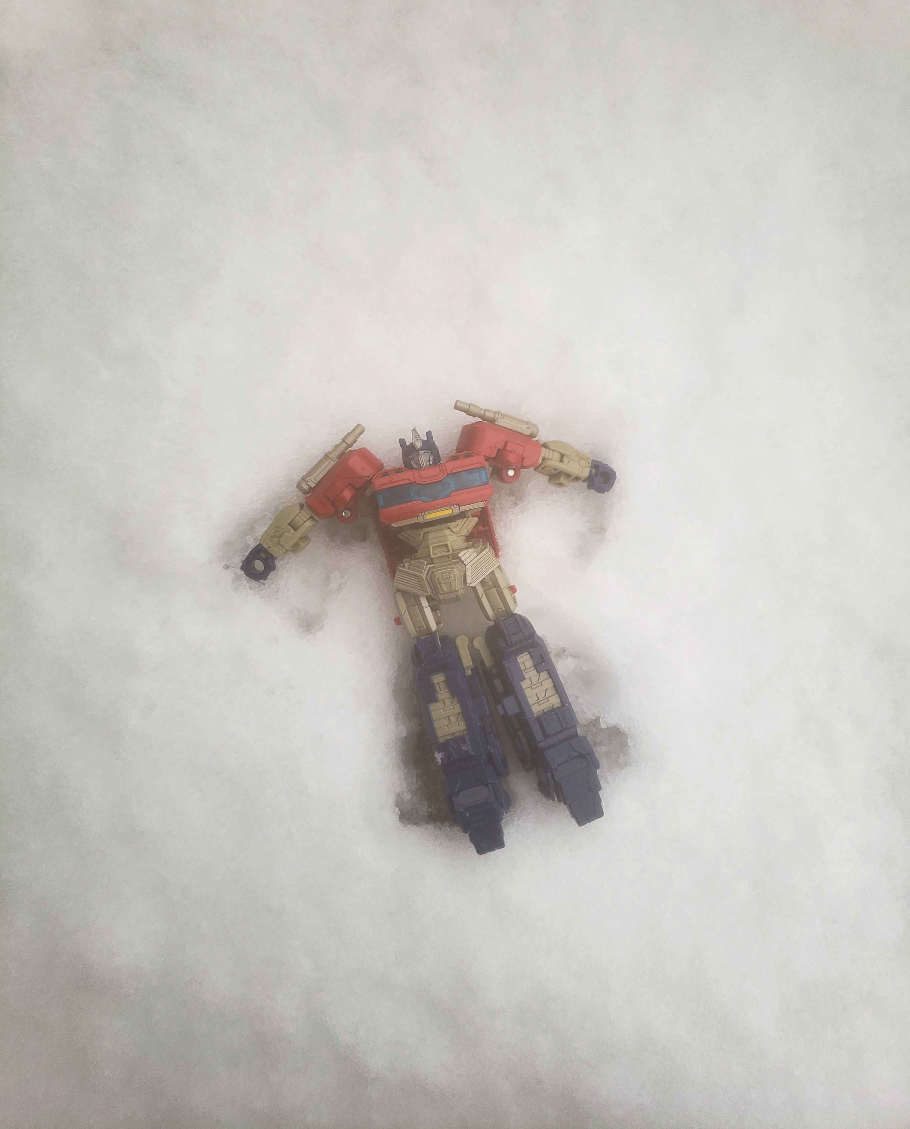 Optimus making a snow angel.